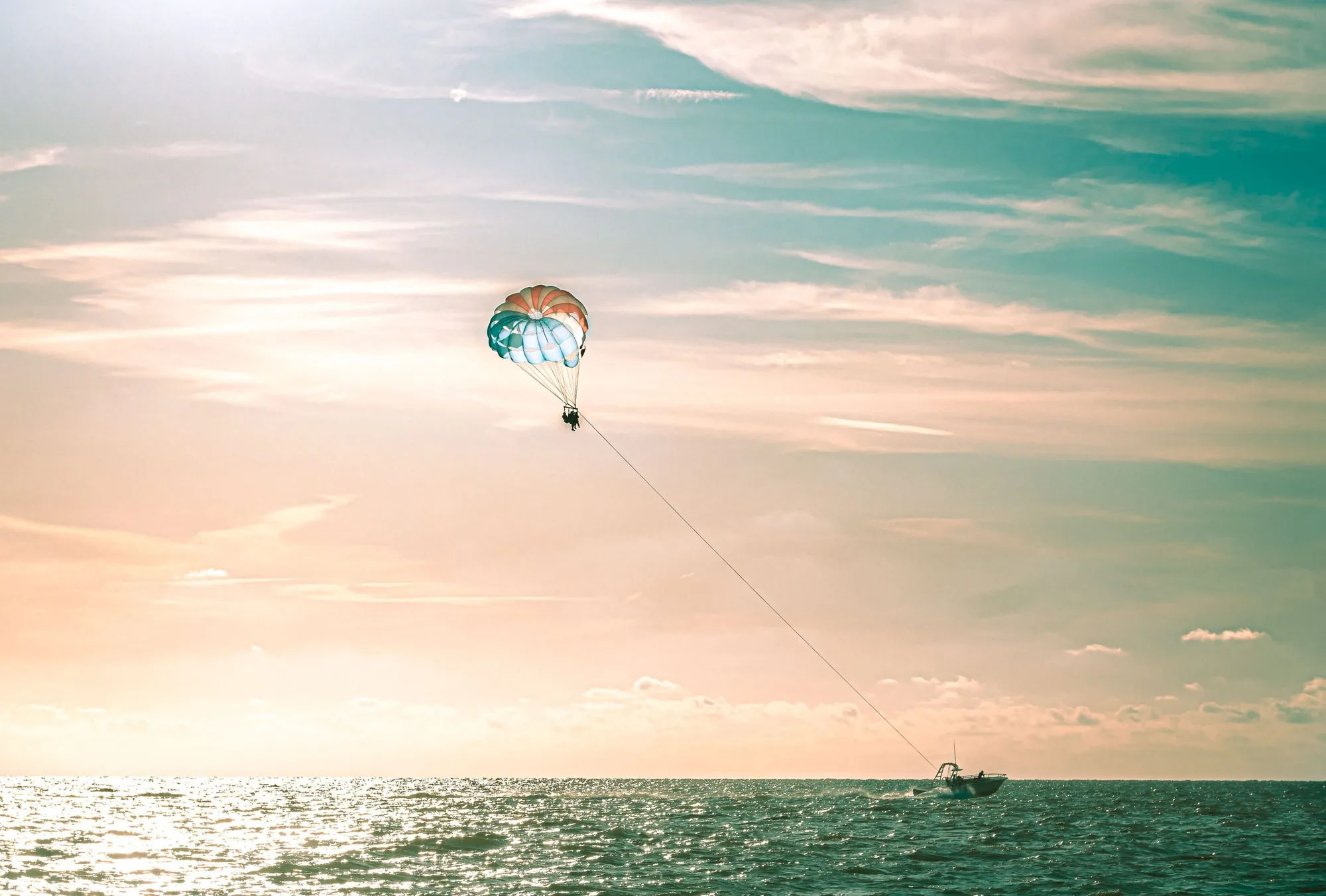 City of Clearwater sunset at the beach with parasailing.