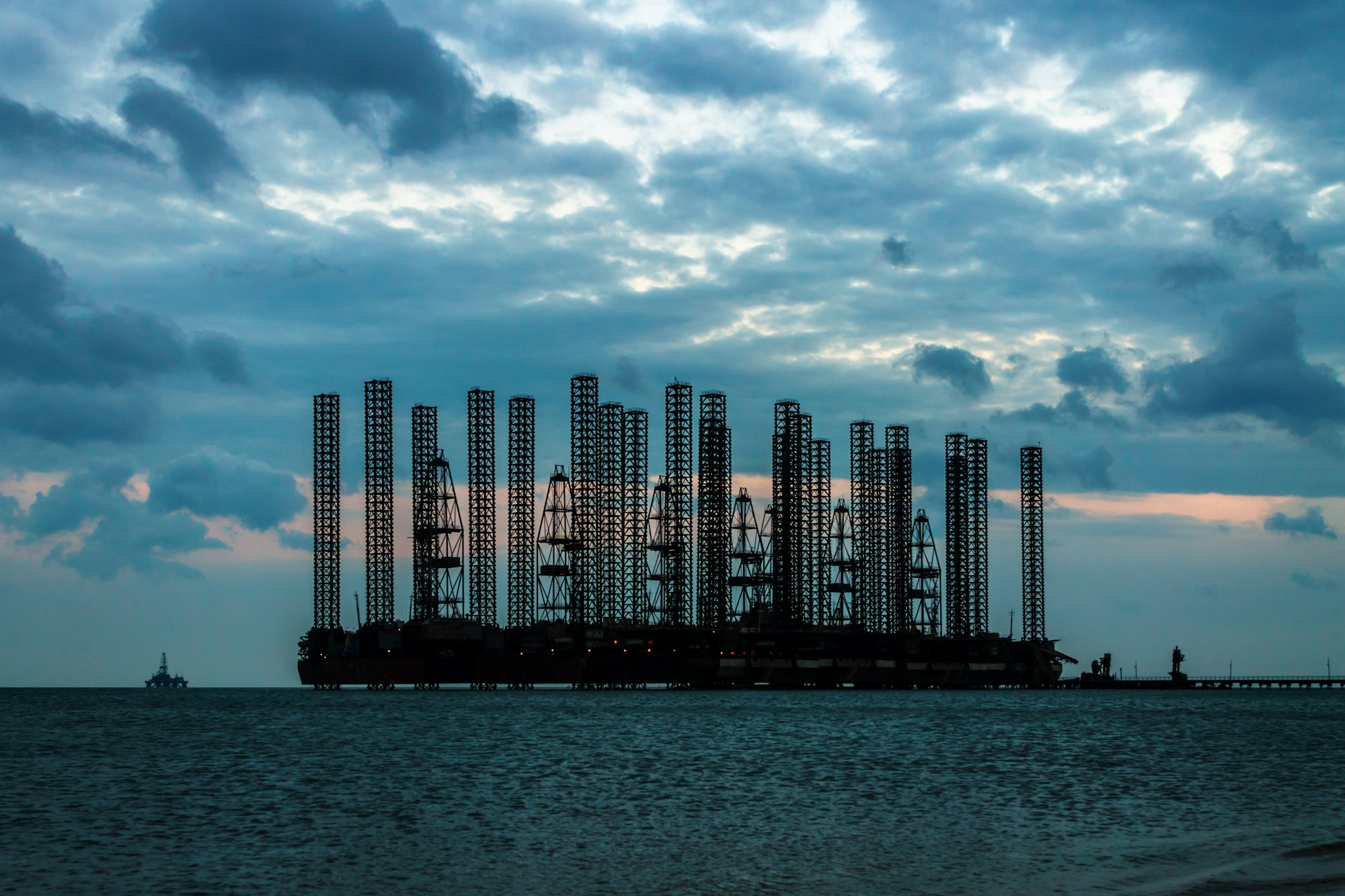 Oil platform in sea. Evening sky